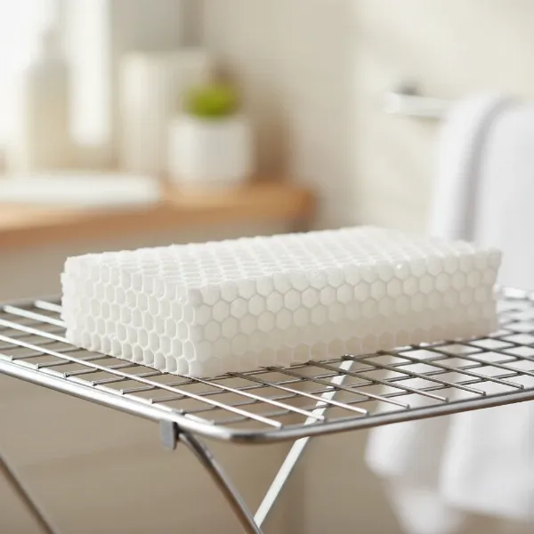 A clean evaporative humidifier wicking filter drying completely on a rack after cleaning to prevent mold.